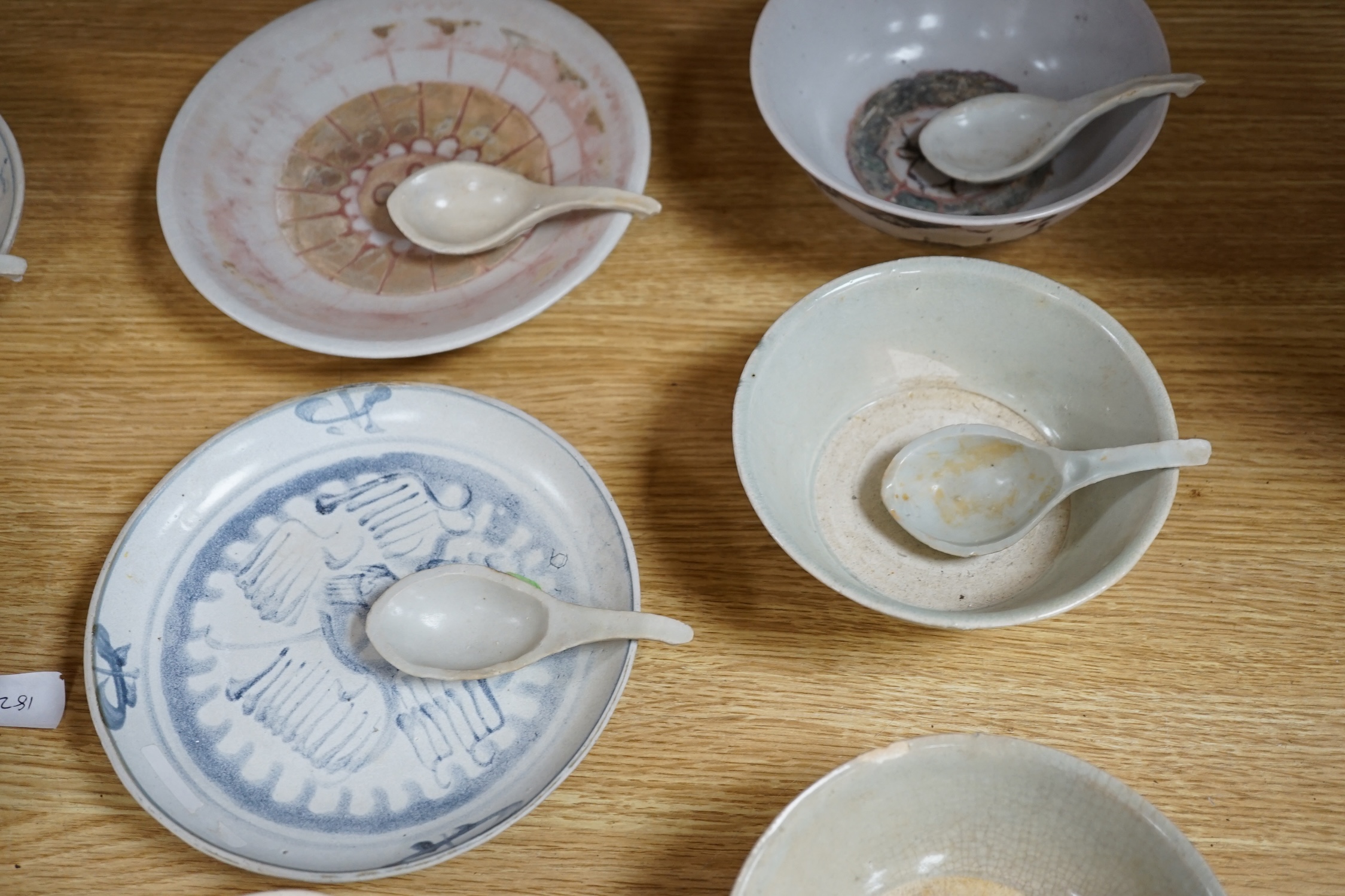 A group of Chinese Tek Sing cargo wares, including blue and white or enamelled plates, bowls, spoons, tea bowls, etc. (42)